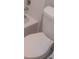 Bathroom featuring a white toilet, toilet seat, bathtub, and white tile at 4111 Pine Heights Ne Dr, Atlanta, GA 30324