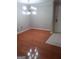 Cozy living space featuring hardwood floors, leading to white-tiled area near entrance at 4111 Pine Heights Ne Dr, Atlanta, GA 30324