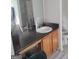 Bathroom featuring a wood vanity, dark countertop, and white sink at 11714 Double Lake Xing, Fayetteville, GA 30215