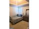 Comfortable bedroom with neutral carpet, a wooden bed frame, and a dresser with a mirror at 11714 Double Lake Xing, Fayetteville, GA 30215