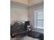 Bedroom with a large window, desk, and carpeted floor at 11714 Double Lake Xing, Fayetteville, GA 30215
