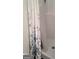 Cozy shower with flower-patterned curtain and white basin at 11714 Double Lake Xing, Fayetteville, GA 30215