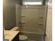 Standard bathroom features a shower-tub combo with white fixtures, a toilet, and a vanity at 47 Elm St, Hampton, GA 30228