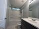 Clean bathroom featuring a shower-tub combination and a modern vanity at 47 Elm St, Hampton, GA 30228