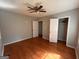 Bedroom featuring hardwood floors and a ceiling fan at 47 Elm St, Hampton, GA 30228