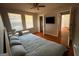 Bedroom featuring hardwood floors, neutral paint, and a mounted TV at 47 Elm St, Hampton, GA 30228