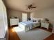Comfortable bedroom with natural light, neutral paint, ceiling fan, and carpet at 47 Elm St, Hampton, GA 30228