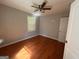 Bedroom featuring hardwood floors and a ceiling fan at 47 Elm St, Hampton, GA 30228
