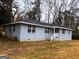 Charming single-story home with gray brick and a well-maintained front yard, perfect for Gathering living at 47 Elm St, Hampton, GA 30228