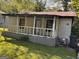 Cottage-style home with a front porch needing repairs and general maintenance at 47 Elm St, Hampton, GA 30228
