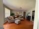 Cozy living room featuring hardwood floors, neutral walls, and comfortable seating arrangements at 47 Elm St, Hampton, GA 30228