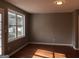 Spacious room with hardwood floors and abundant natural light through a large window at 47 Elm St, Hampton, GA 30228
