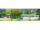 Exterior shot of houses with cars parked in front and trees nearby at 47 Elm St, Hampton, GA 30228