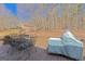 Outdoor deck with dining set, grill, and backyard view, perfect for entertaining or relaxing in nature at 245 Longshore Way, Fayetteville, GA 30215