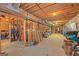 Unfinished basement space with exposed ceiling, offering potential for workshop, storage, or recreation area at 245 Longshore Way, Fayetteville, GA 30215