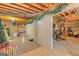 Partially finished basement with storage, laundry hookups, and space for a workshop or additional living area at 245 Longshore Way, Fayetteville, GA 30215