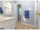 Bright bathroom showcasing a white vanity, and a blue towel rack at 245 Longshore Way, Fayetteville, GA 30215