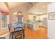 Charming dining room with natural light, hardwood floors, and adjacent to the kitchen at 245 Longshore Way, Fayetteville, GA 30215