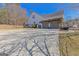 Spacious driveway leading to a two-car garage, surrounded by mature landscaping at 245 Longshore Way, Fayetteville, GA 30215