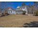 Lovely two-story home with a covered porch and well-manicured lawn creating inviting curb appeal at 245 Longshore Way, Fayetteville, GA 30215