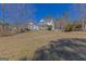 Beautifully maintained two-story home with classic architectural elements and a spacious front lawn at 245 Longshore Way, Fayetteville, GA 30215
