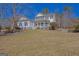 Charming two-story home featuring a welcoming front porch and traditional architectural details at 245 Longshore Way, Fayetteville, GA 30215