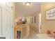 Bright hallway offering a view of the living space with a staircase and neutral walls at 245 Longshore Way, Fayetteville, GA 30215