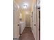 Functional hallway/laundry area with washer, dryer, storage cabinets and access to outside at 245 Longshore Way, Fayetteville, GA 30215