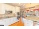Gourmet kitchen with granite countertops and stainless steel appliances at 245 Longshore Way, Fayetteville, GA 30215