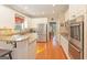 Spacious kitchen with stainless steel appliances, granite countertops, and hardwood floors at 245 Longshore Way, Fayetteville, GA 30215
