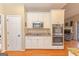 Updated kitchen with white cabinets, stainless steel appliances, and a granite countertop at 245 Longshore Way, Fayetteville, GA 30215