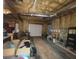 Unfinished basement with overhead beams and a garage door at 7810 Capps Ferry Rd, Douglasville, GA 30135