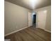 Standard bedroom featuring light-colored walls and vinyl flooring at 7810 Capps Ferry Rd, Douglasville, GA 30135
