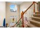 Grand entryway with staircase, large window, and decorative front door, creating a welcoming and bright entrance at 176 Fairoaks Cir, Stockbridge, GA 30281