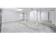 Large unfinished basement featuring utility poles, drop ceiling, and door to outside at 415 Southmoor Cir, Stockbridge, GA 30281