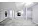 Large unfinished basement space with utility poles, carpet, and white trim at 415 Southmoor Cir, Stockbridge, GA 30281
