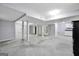 Large unfinished basement featuring utility poles, drop ceiling, and kitchenette area at 415 Southmoor Cir, Stockbridge, GA 30281