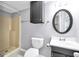Bathroom with shower, vanity, oval mirror, and updated fixtures at 415 Southmoor Cir, Stockbridge, GA 30281