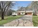 Traditional-style home featuring an attached garage and a spacious driveway at 415 Southmoor Cir, Stockbridge, GA 30281