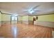 Spacious living room featuring hardwood floors, neutral wall paint, and two sets of french doors at 415 Southmoor Cir, Stockbridge, GA 30281