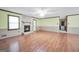Bright and airy living room with a stone fireplace, ceiling fan and light-toned walls at 415 Southmoor Cir, Stockbridge, GA 30281