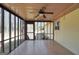 This screened porch features a ceiling fan and offers an outdoor living space at 415 Southmoor Cir, Stockbridge, GA 30281