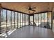 Enclosed sunroom with ceiling fan and sliding glass doors at 415 Southmoor Cir, Stockbridge, GA 30281