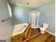 Bathroom featuring a corner soaking tub and shower at 36 Reese St, Grantville, GA 30220