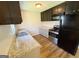 The kitchen has stainless appliances, two-tone cabinets, and granite countertops at 36 Reese St, Grantville, GA 30220