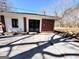 The house's back exterior features brick and white siding with a concrete patio at 1209 Topaz Ln, Villa Rica, GA 30180