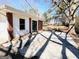 The house's back exterior showcases brick and white siding, highlighted by a concrete patio at 1209 Topaz Ln, Villa Rica, GA 30180