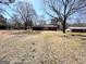 View of the house and backyard from the end of the yard at 1209 Topaz Ln, Villa Rica, GA 30180