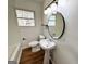 Bathroom featuring pedestal sink and modern lighting at 1209 Topaz Ln, Villa Rica, GA 30180
