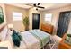 A furnished bedroom with soft, natural lighting and hardwood floors at 1209 Topaz Ln, Villa Rica, GA 30180